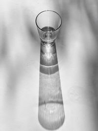 High angle view of glass of water on table