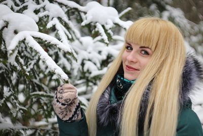 Portrait of young woman in snow