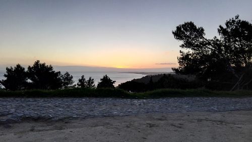 Scenic view of sea against sky at sunset