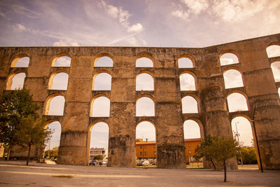 Low angle view of old ruins against sky