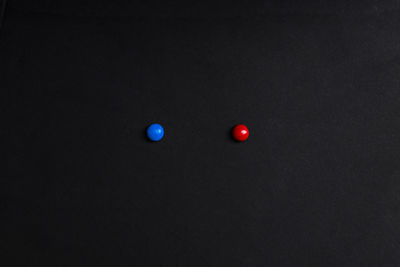 High angle view of red ball on black background