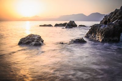 Scenic view of sea at sunset