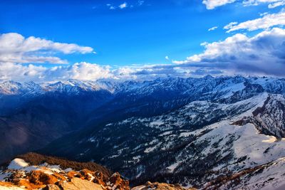 Scenic view of snowcapped mountains against sky