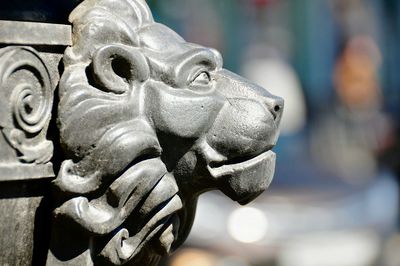 Close-up of metallic lion sculpture