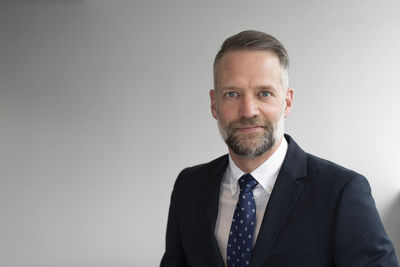 Portrait of businessman looking at camera