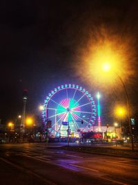 Ferris wheel against sky at night