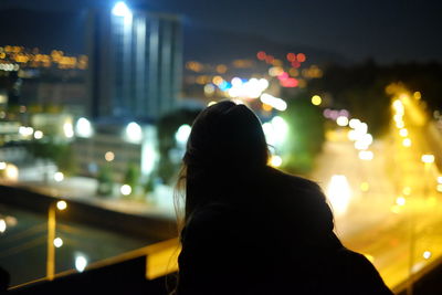 Defocused image of illuminated lights in city