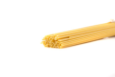 Close-up of yellow cake against white background