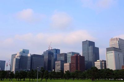 Skyscrapers in city against sky