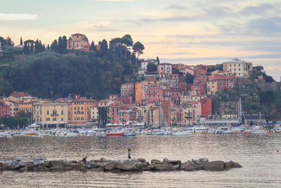 The historic village of lerici on the gulf of poets, illuminated by the sunset light.