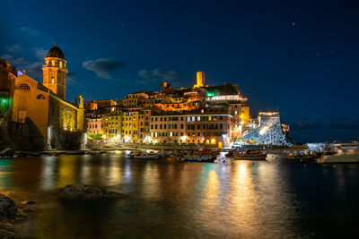 Illuminated buildings in city at night