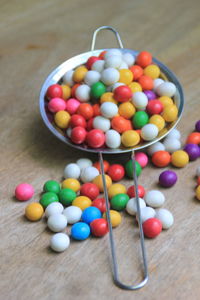 High angle view of multi colored candies on table