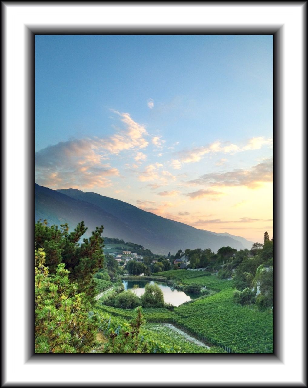 transfer print, mountain, landscape, sky, scenics, tranquil scene, tranquility, tree, beauty in nature, auto post production filter, nature, mountain range, cloud, horizon over land, cloud - sky, plant, idyllic, field, hill, non-urban scene