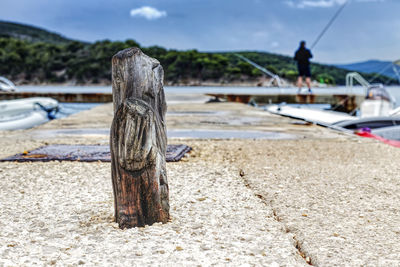 Close up of a wooden cleats at a marina on cres island