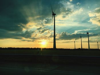 Low angle view of silhouette field against sky during sunset