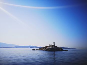 Scenic view of sea against clear blue sky