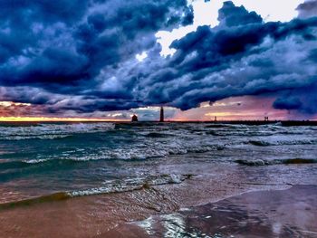 Scenic view of sea against dramatic sky