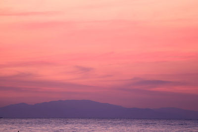 Scenic view of sea against romantic sky at sunset