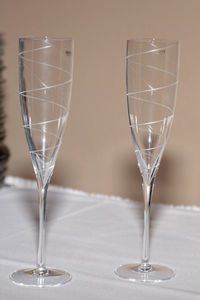 Close-up of empty champagne flutes on table