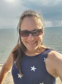 Portrait of a smiling young man on beach