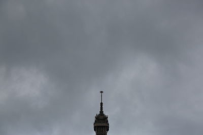 Low angle view of building against cloudy sky