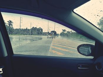 Reflection of car on side-view mirror