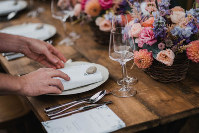 Midsection of man having food on table