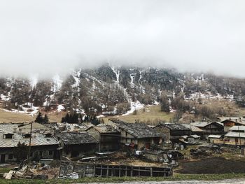 High angle view of houses and trees against sky during winter