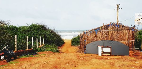 Built structure on beach against sky