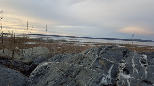 Scenic view of sea against cloudy sky
