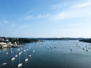 High angle view of sailboats by sea against sky