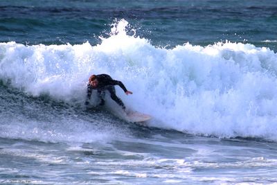 Man surfing in sea