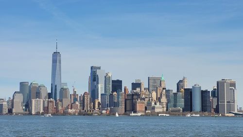 Buildings in city against sky