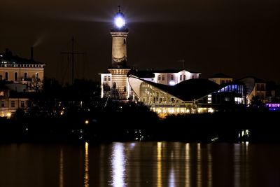 Illuminated buildings in city at night