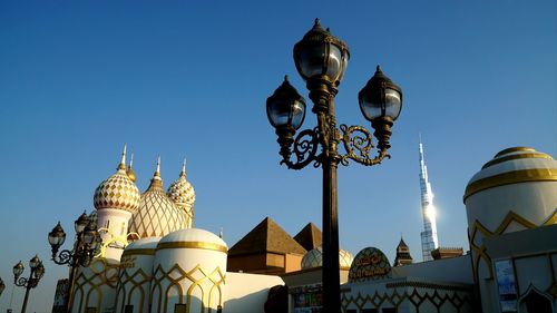 Low angle view of buildings against blue sky