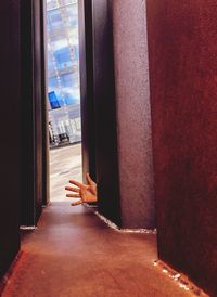 Man seen through glass window of building