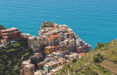 High angle view of residential district by sea