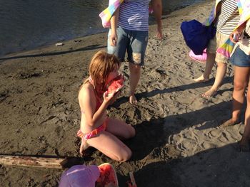 Children playing on sand at beach