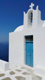 View of white building against blue sky