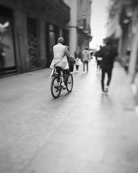 People riding bicycle on road