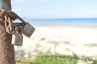 Close-up of padlock on metal