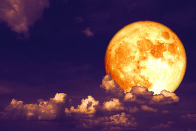 Low angle view of moon against sky at sunset