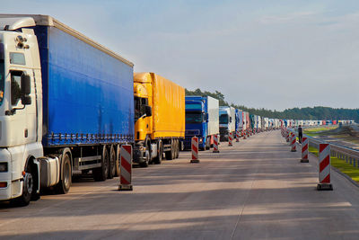 A large line of trucks on the european highway. logistic and transport concept.