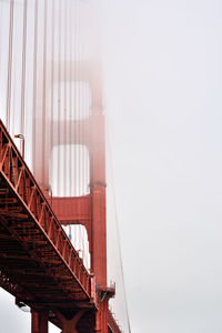 Low angle view of golden gate bridge against sky