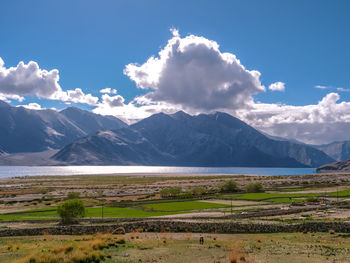 Scenic view of landscape and mountains against sky