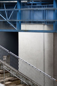 Metal bridge against wall in city