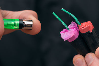 Close-up of person holding multi colored hand