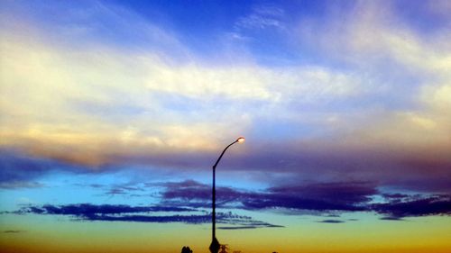 Low angle view of cloudy sky at sunset