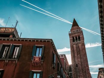 Low angle view of buildings against blue sky