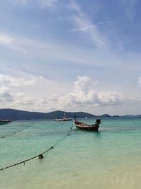 Boat in sea against sky